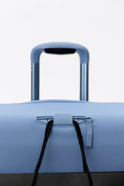 The Hybrid Check-In Luggage Cover in Dusty Blue